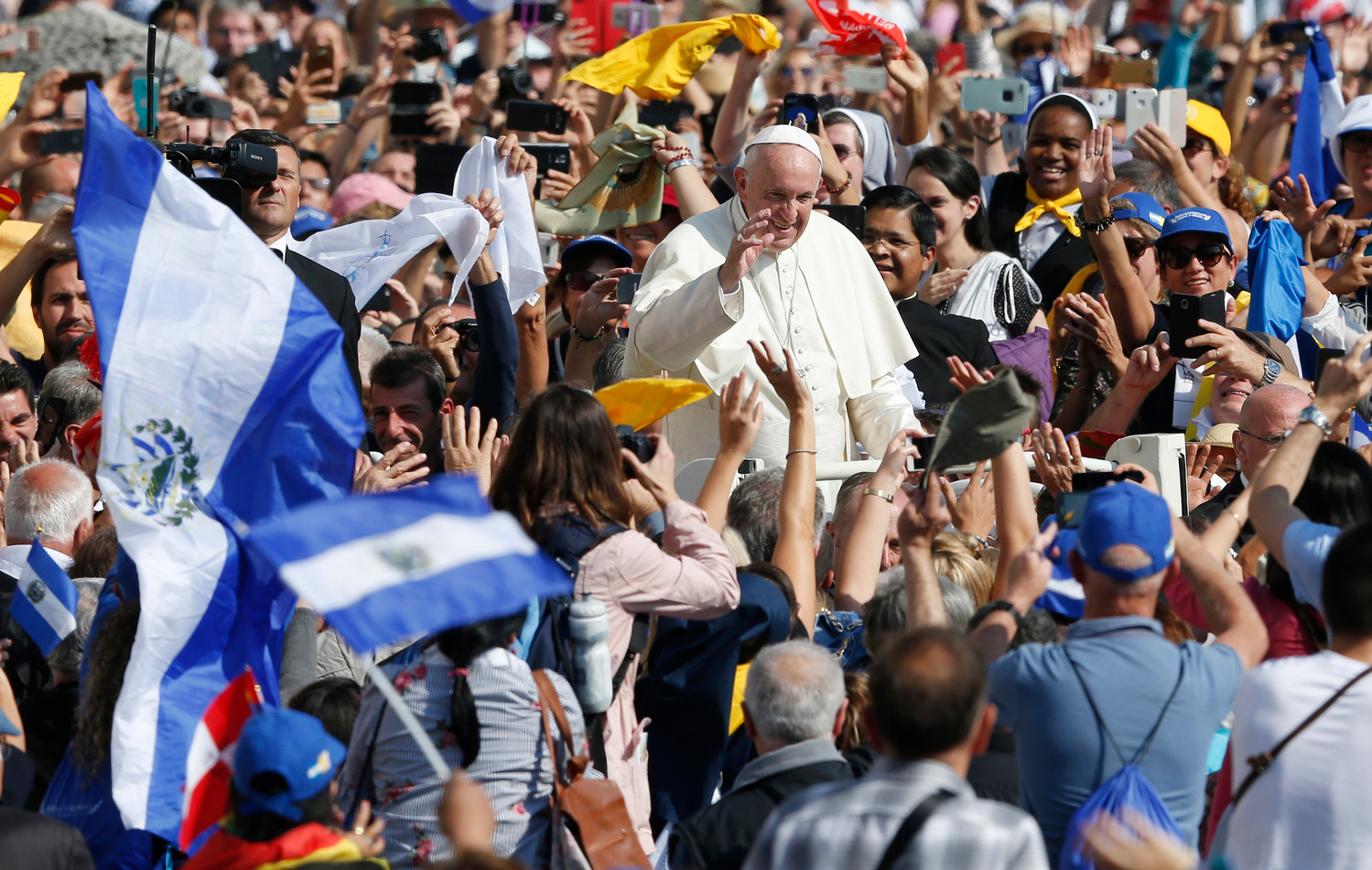 Pope Francis greets the crowd after celebrating the canonization Mass for seven new saints in St. Peter’s Square at the Vatican Oct. 14. Among those canonized were St. Paul VI and St. Oscar Romero.